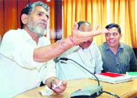Uttarakhand Minister of Food and Civil Supplies Diwakar Bhatt addresses a press conference in Dehradun 