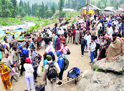 Amarnath yatris at Chandanwari on the way to the cave shrine on Tuesday