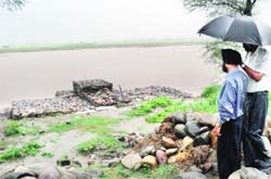Ongoing repair work at the Dhussi Bundh in Shahkot. 