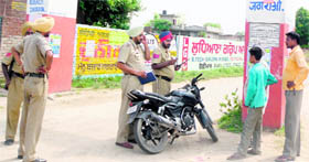 Police officials investigate into the incident outside the gate of Sanmati Government Science and Research College in Jagraon on Tuesday.