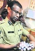 Hyderabad city police chief AK Khan shows seized gelatin sticks