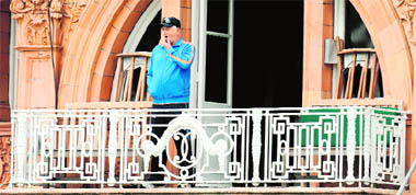 India's coach Duncan Fletcher looks on from the dressing room balcony before a training session at Lord's cricket ground in London on Tuesday.