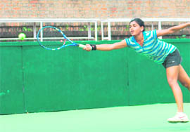 Natasha Palha plays a shot during her match in the CLTA-AITA Chandigarh Open-50K Mens and Womens Tennis Tournament at the CLTA complex in Sector 10 of Chandigarh on Wednesday. 