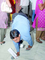 A disabled gets his name registered at the job fest in New Delhi on Wednesday