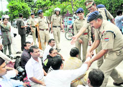 Members of the Rajya Andolankari Manch, who staged a dharna in front of the Secretariat, are removed by the police in Dehradun on Wednesday. 