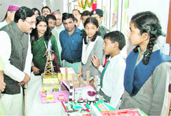 Uttarakhand Chief Minister Ramesh Pokhriyal Nishank goes around a state-level science exhibition in Dehradun on Wednesday. 
