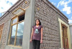 Skalzang Angmo outside her new house in Choglamsar.