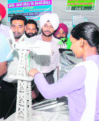 A student shows the working of a science model during an exhibition at Sain Dass AS Senior Secondary School in Jalandhar 
