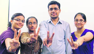 (From left) Toppers Chetna Thapar, Heena Goyal, Akashdeep Grover and Harpreet Kaur in a jubilant mood in Ludhiana 