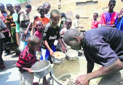 Internally-displaced Somali children receive food in Wabari district, southern Mogadishu