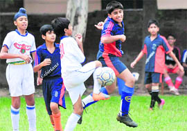 Players of St Johns School and St Kabir School in action during the Pre-Suboroto Mukerjee Football Tournament at Sector 22, Chandigarh