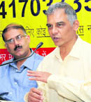 Karnataka DGP ST Ramesh makes a point while  psychiatrist Ashish Despande from Mumbai looks on at a function organised by the Alcoholics Anonymous in Chandigarh 