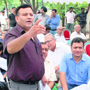 A bidder during an auction organised by HUDA in Panchkula 