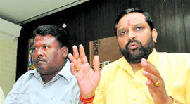 Bhagwat Prasad Makwana (right), Chairman of the Uttarakhand Safai Karamchari Ayog, addresses a press conference in Dehradun on Thursday.