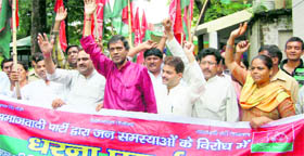 Workers of the Samajwadi Party hold a demonstration in front of the office of the Dehradun District Magistrate on Thursday.