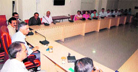 Deputy commissioner Yudhbir Singh Khyalia addresses a meeting of doctors in Sirsa.