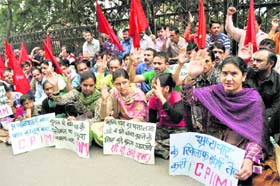 CPM activists raise slogans during a protest rally in Shimla on Thursday