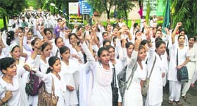 Students of Government College for Women, Gandhi Nagar, stage a protest in Jammu on Thursday