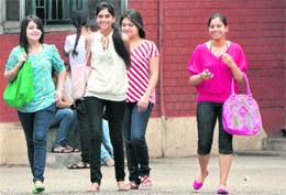 Trendily attired students attend the first day of college in Ludhiana on Thursday.