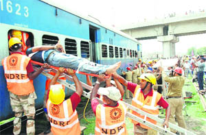 National Disaster Response Force and the Railways staff rescue passengers from a bogey during a mock drill in Bathinda.