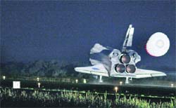 Atlantis glides home through a moonlit sky for its final landing at the Kennedy Space Center in Florida 