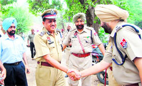 Police officials welcome newly appointed Commissioner of Police RP Mittal (second from left) at Amritsar on Friday.