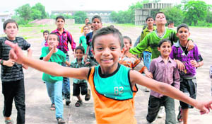 Children from terrorist-affected areas of J&K and cloudburst victims of Leh in a celebratory mood after visiting the High Court (in the background). The children were on a visit to Chandigarh