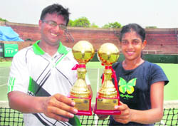 Vaidik and Natasha pose with their winners trophies at the CLTA complex at Sector 10 in Chandigarh on Friday.