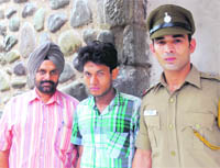 Accused Tara Chand in police custody in Chandigarh on Friday. 