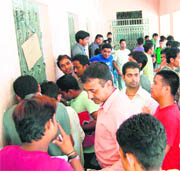 Admission seekers at a counter of DAV (PG) College in Dehradun on Friday