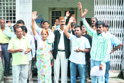 Some residents of Banjarawala stage a protest against alleged illegal construction work in their area at the office of the District Magistrate, Dehradun, on Friday