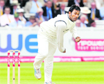 All-round Captain: Wicketkeeper MS Dhoni bowls against England at Lord's in London, on Friday