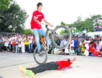Rider Manu Chauhan performs a stunt at the Sukhna Lake on Saturday. 