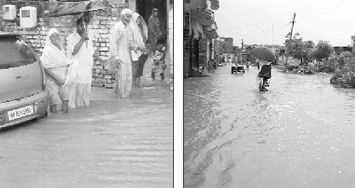 Rainwater enters a house; and (right) a cyclist wades his way through a waterlogged street in Lalru on Saturday.