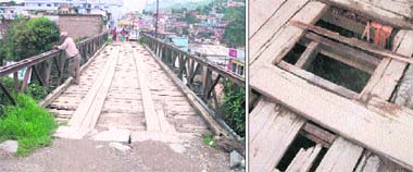 The bridge on the Rishikesh-Gangotri highway that is in a dilapidated condition; and (right) holes in the bridge