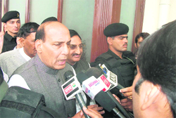 Former BJP President Rajnath Singh talks to mediapersons after the conclusion of a party meeting in Mussoorie on Saturday.