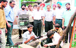 Senior Deputy Mayor Parveen Bansal (left), Municipal Commissioner AK Sinha inspect the removal of the sludge near Chand Cinema in Ludhiana.