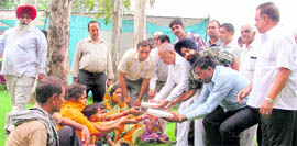 Health and Family Welfare Minister Satpal Gosain serves food to the needy patients at the Civil Hospitsal in Ludhiana.