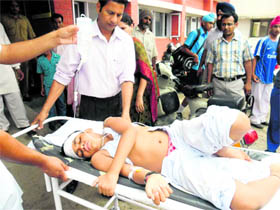 An injured student being taken to hospital.