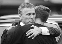 Norwegian PM Jens Stoltenberg embraces Eskil Pedersen, leader of the Norwegian Labour Youth league and survivor of the Utoeya island shooting, at a hotel where survivors of the youth camp attack are being reunited with their families in Sundvolden, 40 km from Oslo