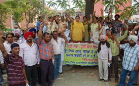  Rural health pharmacists hold a protest in support of their demand outside the Mini-secretariat in Bathinda on Sunday. 