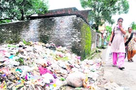 Garbage littered at an open space in the Khurbura ward of Dehradun city