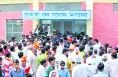 Villagers lock the 33-KV power substation in protest against the erratic power supply at Bhirdana in Fatehabad on Sunday. 