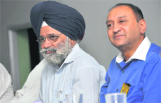 PAU VC Baldev Singh Dhillon (L) and district governor of Rotary Club Sanjiv Sethi during the club ceremony in Ludhiana.