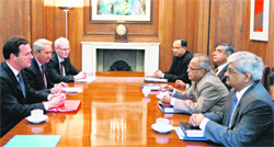 Britain's Chancellor of the Exchequer George Osborne, left, in conversation with India's Finance Minister Pranab Mukherjee during the UK-India Economic and Financial Dialogue, at his office in central London Monday.