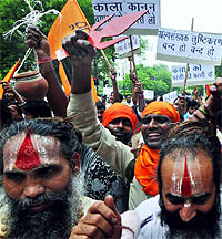Vishwa Hindu Parishad activists protest against the Prevention of Communal and Targeted Violence Riots Bill, which they think is anti-Hindu, in New Delhi on Monday.