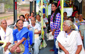 Underprivileged senior citizens and children from NGOs enjoy a free ride on one of the seven HOHO buses launched by the Delhi Tourism in New Delhi on Monday.