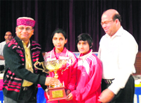 Khajan Das, Uttarakhand Education Minister, gives away the trophy to the winners of the table tennis tournament at Mussoorie.