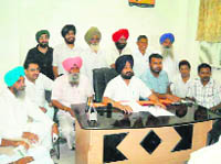 RP Singh Maini (in black turban) addresses the media at Tarn Taran on Monday. 