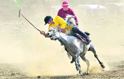 A match in progress between Ladakh Scouts (red) and Polo Club (yellow) at the famous Polo Ground in Drass during the Vijay Divas celebrations on Monday. 